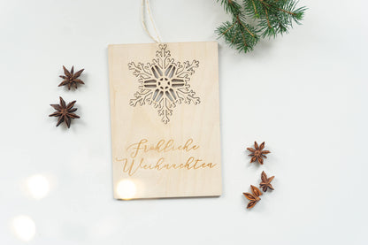 Postkarte zur Weihnachtszeit mit Schneeflocke zum Aufhängen